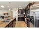 Open kitchen with granite countertops, stainless steel appliances, and ample cabinet space at 15442 W Sells Dr, Goodyear, AZ 85395