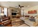 Cozy living room with stone fireplace and comfortable seating area at 15442 W Sells Dr, Goodyear, AZ 85395