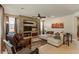 Spacious living room with tile floors, neutral decor, and a stylish stone accent wall at 15442 W Sells Dr, Goodyear, AZ 85395