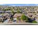 Scenic neighborhood view featuring attractive homes, mature trees, and well-manicured desert landscaping at 15442 W Sells Dr, Goodyear, AZ 85395