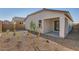 The backyard features desert landscaping and a covered patio at 15564 W Williams St, Goodyear, AZ 85338