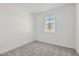 Bedroom features carpet, neutral walls, and a window with blinds at 15564 W Williams St, Goodyear, AZ 85338