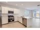 Stylish kitchen equipped with modern stainless steel appliances and sleek countertops at 15564 W Williams St, Goodyear, AZ 85338