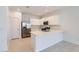Bright kitchen boasts modern stainless steel appliances, white cabinets, and quartz countertops at 15564 W Williams St, Goodyear, AZ 85338