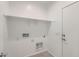 Laundry room featuring shelving and a utility sink at 15564 W Williams St, Goodyear, AZ 85338
