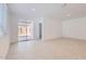 Bright living area with tile floors and access to a private backyard through sliding glass doors at 15564 W Williams St, Goodyear, AZ 85338