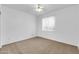 A comfortable carpeted bedroom with a ceiling fan and bright, natural light at 15865 E Lost Hills Dr, Fountain Hills, AZ 85268