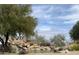 Beautiful community entrance with a pond, waterfall and desert landscaping in Fountain Hills at 15865 E Lost Hills Dr, Fountain Hills, AZ 85268