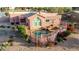 Stunning elevated view of the pink-hued home featuring a private pool and fenced yard at 15865 E Lost Hills Dr, Fountain Hills, AZ 85268