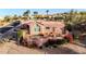 Charming home with a backyard pool and deck area surrounded by beautiful desert landscaping at 15865 E Lost Hills Dr, Fountain Hills, AZ 85268