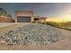 The beautiful home boasts a desert landscape, a garage, and is in close proximity to local amenities at 15865 E Lost Hills Dr, Fountain Hills, AZ 85268