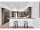 Eat-in kitchen with granite countertops, stainless appliances, and counter seating perfect for entertaining guests at 15865 E Lost Hills Dr, Fountain Hills, AZ 85268