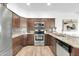 Well-lit kitchen features granite countertops, stainless steel appliances, and tiled backsplash at 15865 E Lost Hills Dr, Fountain Hills, AZ 85268