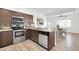 Well-equipped kitchen with stainless steel appliances and granite countertops, flowing into the adjacent dining area at 15865 E Lost Hills Dr, Fountain Hills, AZ 85268
