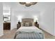 A main bedroom featuring a neutral color palette, soft carpet, and an upholstered headboard at 15865 E Lost Hills Dr, Fountain Hills, AZ 85268