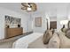 A bright main bedroom featuring a ceiling fan, contemporary artwork, and ensuite bathroom at 15865 E Lost Hills Dr, Fountain Hills, AZ 85268