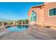 Backyard pool area with seating and a spa offering beautiful views of the mountains at 15865 E Lost Hills Dr, Fountain Hills, AZ 85268