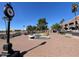 Charming town center square with clock tower, water fountain, and palm trees at 15865 E Lost Hills Dr, Fountain Hills, AZ 85268