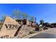 Inviting entrance to the VENU community featuring lush landscaping and a monument sign at 19777 N 76Th St # 2150, Scottsdale, AZ 85255