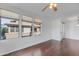 Bright living room with hardwood floors, ceiling fan, and abundant natural light at 19777 N 76Th St # 2150, Scottsdale, AZ 85255