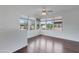 Bright living room with hardwood floors, ceiling fan, and large bright windows at 19777 N 76Th St # 2150, Scottsdale, AZ 85255