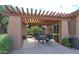 Outdoor seating with a pergola that offers shade in the community's common area at 19777 N 76Th St # 2150, Scottsdale, AZ 85255