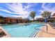 Community pool offers a refreshing escape with lounge chairs and beautiful landscaping at 19777 N 76Th St # 2150, Scottsdale, AZ 85255