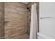 The updated shower showcases neutral tile, a matte black showerhead, and a built-in shelf at 19777 N 76Th St # 2150, Scottsdale, AZ 85255