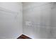 An organized walk-in closet features white walls, wire shelves, and dark wood flooring at 19777 N 76Th St # 2150, Scottsdale, AZ 85255