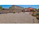 Wide shot of a backyard with desert landscaping and shaded patio at 1994 E Dust Devil Dr, San Tan Valley, AZ 85143