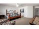 Spacious bedroom featuring a comfy chair, carpet floors and generous space at 1994 E Dust Devil Dr, San Tan Valley, AZ 85143