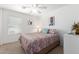 Comfortable bedroom featuring natural light from the window, and a ceiling fan at 1994 E Dust Devil Dr, San Tan Valley, AZ 85143