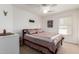 Cozy bedroom featuring carpeted floors, a ceiling fan, and a charming decor at 1994 E Dust Devil Dr, San Tan Valley, AZ 85143