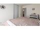 Cozy bedroom features a sliding closet door and neutral decor at 1994 E Dust Devil Dr, San Tan Valley, AZ 85143