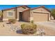 Charming single-story home with desert landscaping and a two-car garage at 1994 E Dust Devil Dr, San Tan Valley, AZ 85143