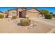 Charming single-story home with desert landscaping and a two-car garage at 1994 E Dust Devil Dr, San Tan Valley, AZ 85143