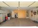 Bright garage featuring storage cabinets and visible utilities at 1994 E Dust Devil Dr, San Tan Valley, AZ 85143