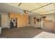 Spacious garage with ample storage cabinets and organization at 1994 E Dust Devil Dr, San Tan Valley, AZ 85143
