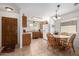 Open kitchen and dining area features wood cabinets and tile flooring at 1994 E Dust Devil Dr, San Tan Valley, AZ 85143