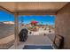 Covered patio offering comfortable seating and outdoor grill at 1994 E Dust Devil Dr, San Tan Valley, AZ 85143