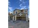 New construction showing the framing of a two-story house with garage under a sunny, blue sky at 2075 E Bucking Bronco Dr, San Tan Valley, AZ 85140