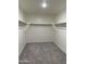 A walk-in closet with carpet and white walls, ready to be organized with shelving and storage at 2075 E Bucking Bronco Dr, San Tan Valley, AZ 85140