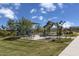 Community park features picnic benches under shade and a playground at 21149 E Canary Way, Queen Creek, AZ 85142