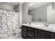 Full bathroom featuring a double sink vanity, a toilet, and a shower with a marble curtain at 25318 N 19Th Dr, Phoenix, AZ 85085