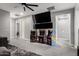 Spacious game room featuring vintage arcade games, a ceiling fan, and ample space for entertainment at 25318 N 19Th Dr, Phoenix, AZ 85085