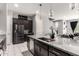 Stylish kitchen featuring granite countertops, stainless steel appliances, and modern pendant lighting at 25318 N 19Th Dr, Phoenix, AZ 85085