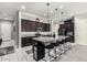 Modern kitchen with dark cabinets, granite countertops, and stainless steel appliances at 25318 N 19Th Dr, Phoenix, AZ 85085