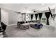 Spacious living room with gray walls, plush carpet, and a large sectional sofa at 25318 N 19Th Dr, Phoenix, AZ 85085