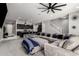 Spacious open-concept living room connected to a modern kitchen and a staircase at 25318 N 19Th Dr, Phoenix, AZ 85085