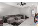 Comfortable seating area with a sectional sofa, plush rug, and view of the game room at 25318 N 19Th Dr, Phoenix, AZ 85085